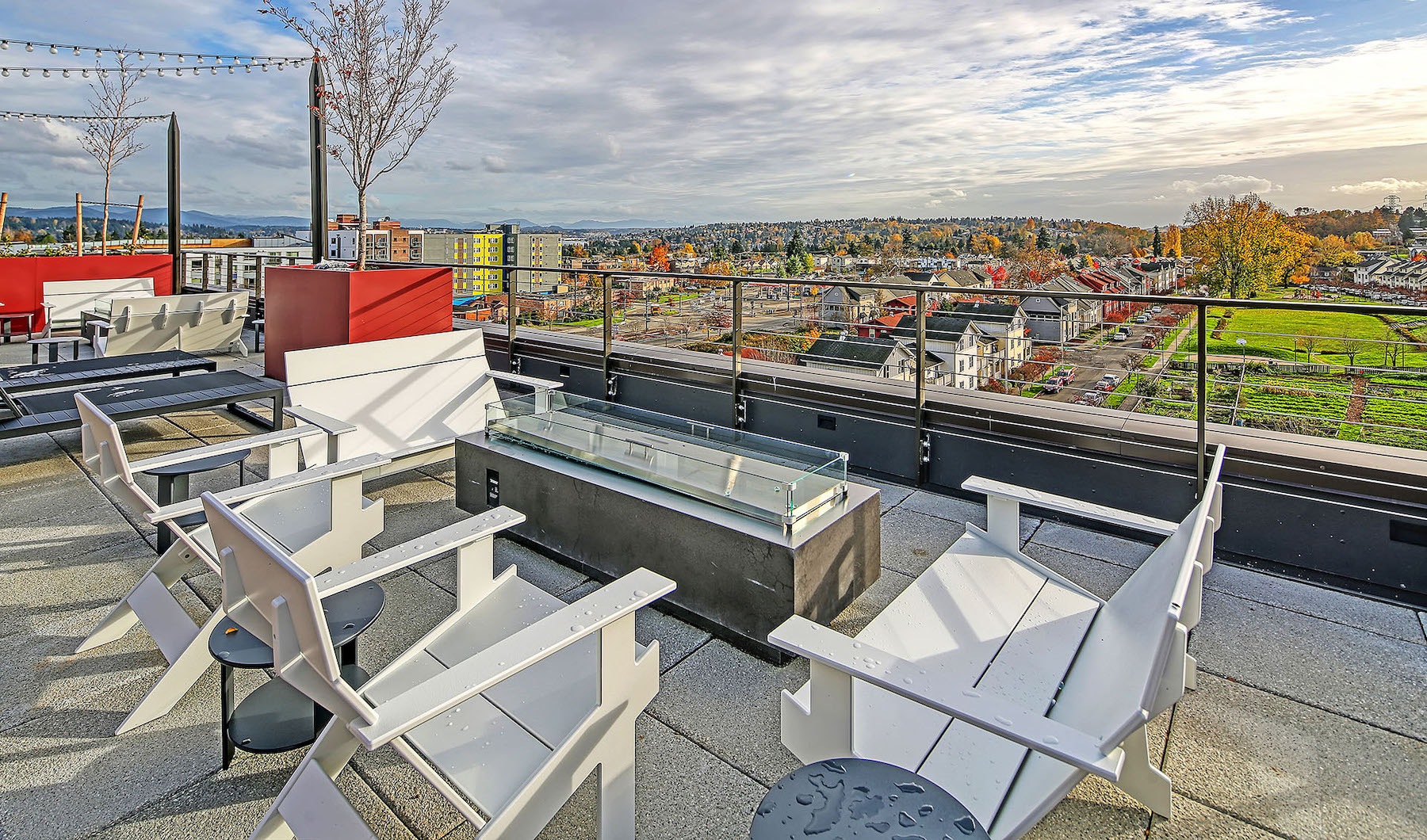 A view from the rooftop deck with entertainment space and outdoor lounge seating